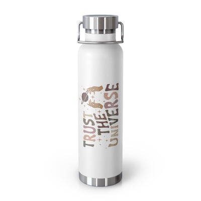 White vacuum insulated tumbler with stainless steel lid and handle.  The artwork is horizontal on the water bottle.  It reads trust the universe. The artwork is in earthy colors and also features hands reaching up to the sky to planets and stars. 