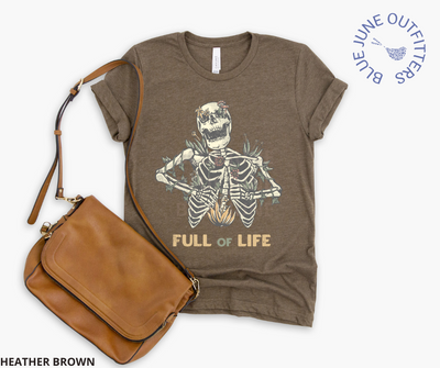 Super soft Bella + Canvas brand shirt in heather brown. This tee is from Blue June Outfitters' exclusive Morbid Nature Collection. It features a skeleton covered in plants has the phrase full of life underneath.