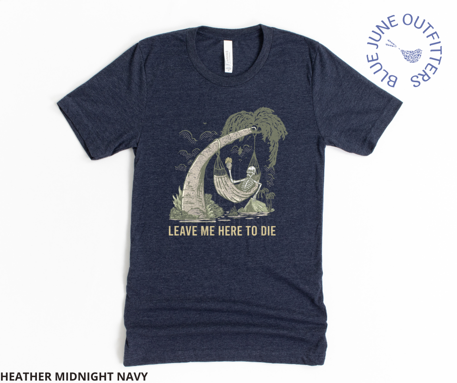 Super soft Bella + Canvas brand tee in heather midnight navy. This shirt from Blue June Outfitters' exclusive Morbid Nature Collection features a skeleton holding a beer in a hammock, camping on the beach. Underneath it reads leave me here to die. Perfect camping tee for those with a dark sense of humor!