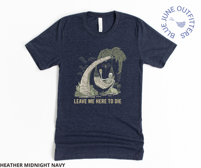 Super soft Bella + Canvas brand tee in heather midnight navy. This shirt from Blue June Outfitters' exclusive Morbid Nature Collection features a skeleton holding a beer in a hammock, camping on the beach. Underneath it reads leave me here to die. Perfect camping tee for those with a dark sense of humor!