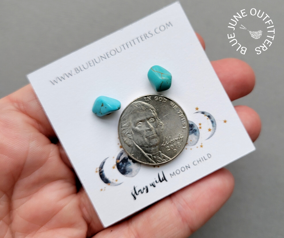 Pair of turquoise earrings next to an United States nickel for size reference. Each one is approximately 1/4 the size of a nickel in this photo.