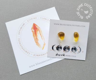 Genuine citrine stud earrings. They are organically shaped with golden yellow coloring. They arrive thoughtfully packaged on an earring card with our web address and celestial moon phase at the bottom of the card in blue and gold that reads Stay Wild Moon Child. Included as well is a 3x3" watercolor turquoise gemstone card that lists the metaphysical properties - optimism, clarity, abundance, centeredness. 