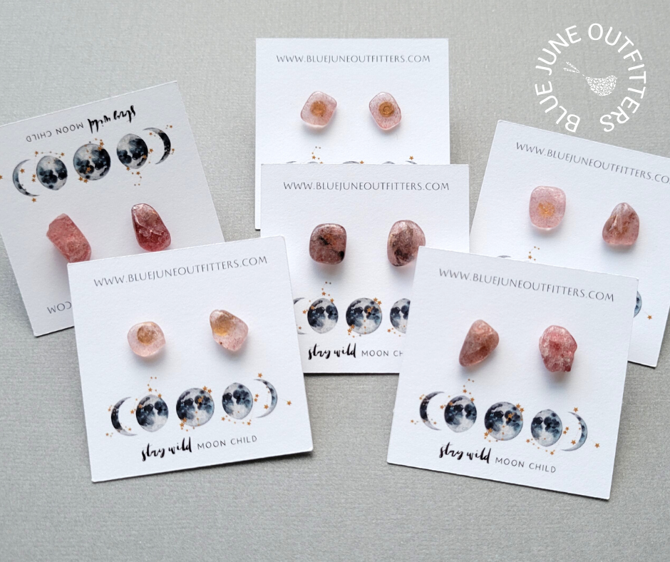Photo of six total pairs of the strawberry quartz studs to show the variations in shape, color and size. They range in size from 5 - 10 mm and vary in color from translucent light pink to dark mauve. 