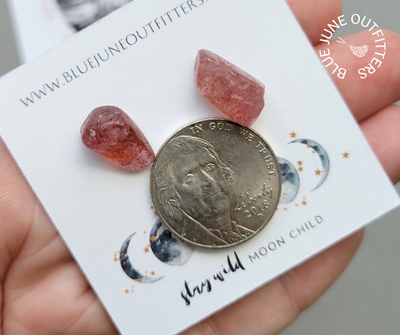 Another pair of studs here are pictured next to a United States nickel to show size variation examples. This pair is a dark mauve and thick. Each stone is approximately half the size of the nickel. 