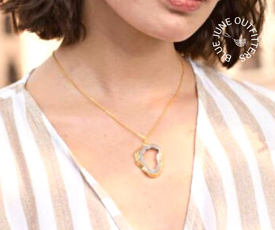 Model wearing the agate slice druzy necklace.  The pendant sits just below her collar bone. 