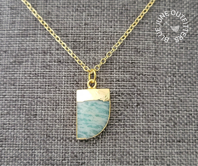 Gold plated necklace with electroplated amazonite gemstone pendant, shaped as a horn and electroplated. 
