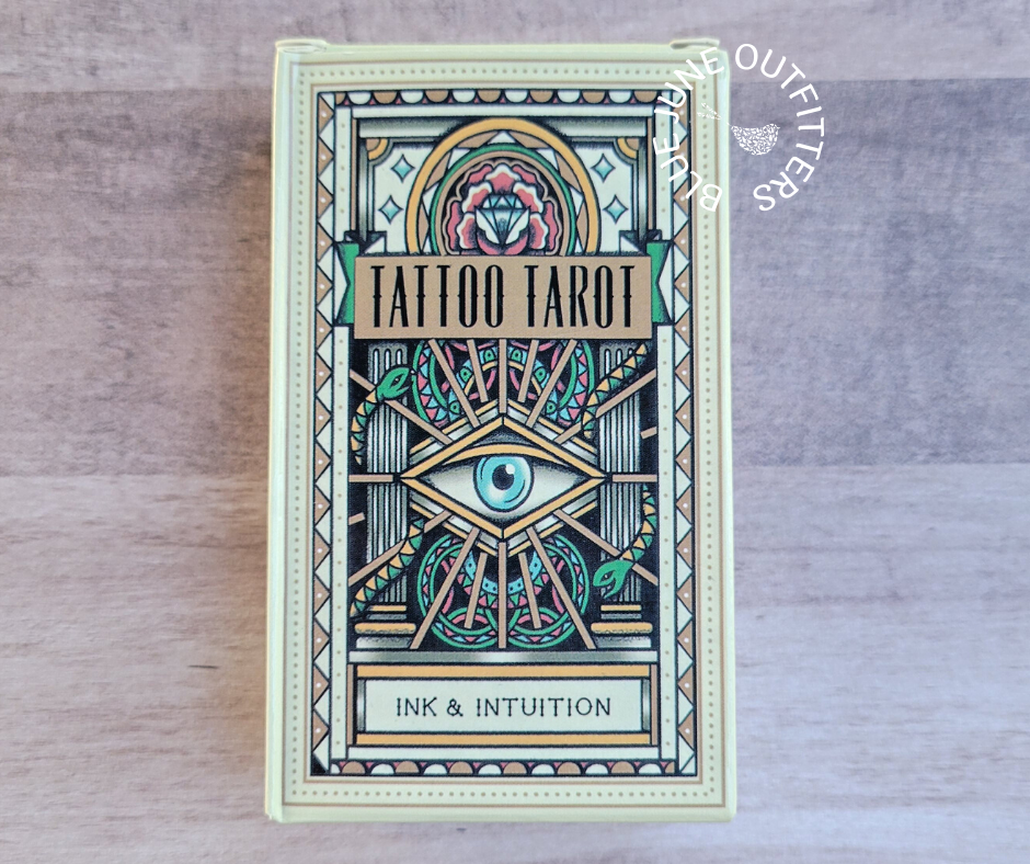 A pack of Tattoo Tarot cards with Ink & Intuition theme, featuring an illustrated tarot card deck and a booklet.