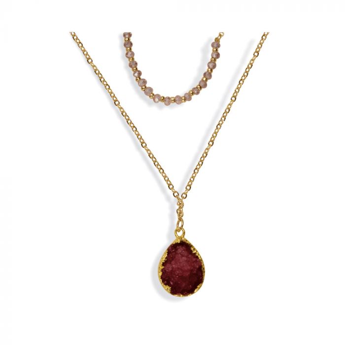 Another view of the dual strand necklace, detailing the texture of the red druzy pendant and light pink glass crystals. 
